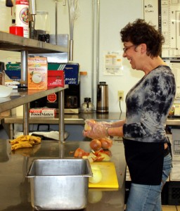 Photo 1_Volunteer prepping food for soup kitchen