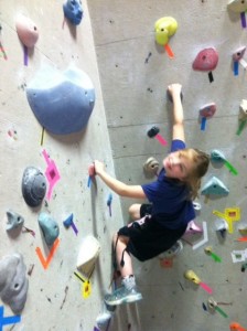 Kids are naturally attracted to the bouldering and rock climbing walls at the Warehosue Rock Gym.