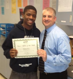 DeJuan Frye poses with his WIAA State Athlete of the Week award with River Ridge High School Athletic Director Gary Larson.  Photo courtesy North Thurston Public Schools.