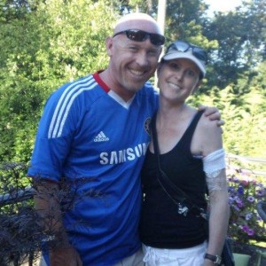 Tumwater High School boys soccer coach Bryan Winkler stands with his sister Leanne, who lost a battle to lung cancer last August.  The T-Birds match against Olympia on Friday night served as a fundraiser for the American Cancer Society.