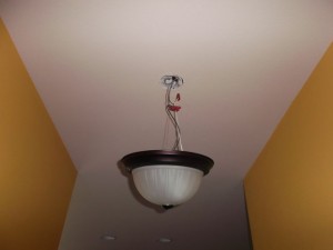 This light was hanging in this fashion in a home not even a year old.