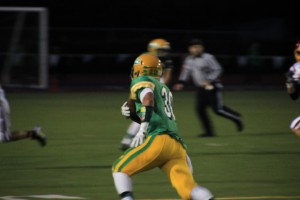 Tumwater high school senior Christian Cummings (running with ball) earned the 2A Evergreen Conference MVP award after posting 30 total touchdowns in 2013.  