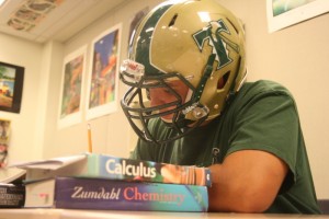 Senior Dylan Reinhold illustrates the stress that an athlete and AP student feels during the season.