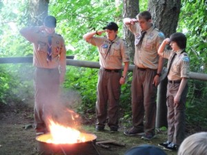 Eric Sundberg participates in Boy Scout Troop 222's flag retirement ceremony.