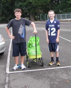 Owen and Drew Thompson collect Thurston County Food Project bags from their neighbors about four years ago, when the project began. Families, like the Thompsons, who have been involved with the TCFP since it's creation were able to the project get off the ground. 