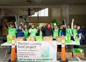 TCFP volunteers celebrate their food collection at Pioneer Elementary School. These volunteers and countless others put in time to try to stop hunger in their community.