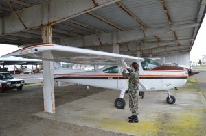 Cadet Staff Sergeant Z’berg (center in the foreground), assists in the pre-flight of the Civil Air Patrol aircraft before the orientation flight. Source: South Sound Composite Squadron