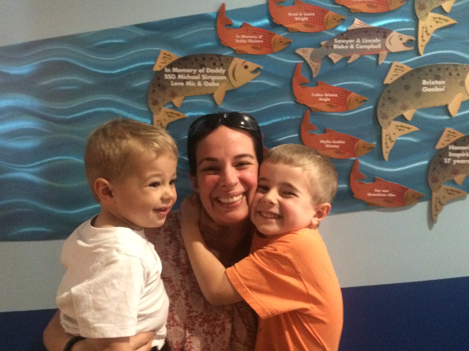 Kirista Simpson and her boys at the dedicatin of their salmon olympia donation