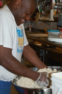 Rick Miller helps prepare chicken salad for Meals On Wheels lunch.