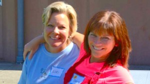 Denise Hardcastle (right), Little Red Schoolhouse Board Member, enjoying a break and friendship with fellow volunteer Lori Allsup during last year's distribution.