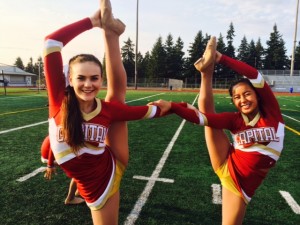 Juniors Emily Cronk and Amy Ly display their flexibility in a bow and arrow pose.