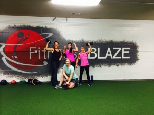 Fitness ablaze sign and women
