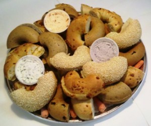A platter including an assortment of bagels and cream cheese is a great way to feed a crowd.
