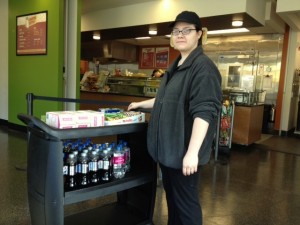 Part of Angie's job in food services is to restock "grab-and-go" items, keeping track of what's needed in the display cases each day.
