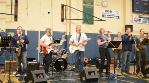 The Olympia High School faculty band of teachers and staff performs at a pep assembly. (Photo Credit: Conor Schober)