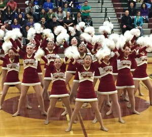 The Cougarettes get fired up for their award winning pom routine.