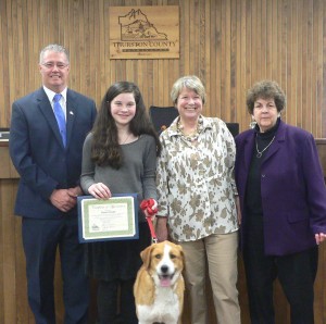 From left to right: Commissioner Blake; national volunteer award winner and 4-H student Fiona Cowell; Fiona’s dog Daisy; Commissioner Romero; Commissioner Wolfe