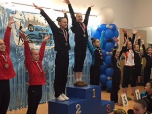 Emily (center) as the State Vault Champion