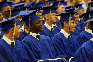 Cadet Andrew Franklin (center of picture) laughs during commencement ceremonies on June 20.