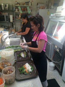 Kim Nguyn (right) and Bibiana Smith work behind the scenes at Soba to prepare for the daily lunch rush.