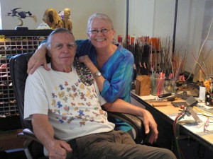 Lampworker Ernie Wagner and designer Darcie Richardson work together in their Olympia studio.