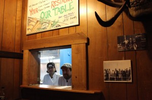 Jose Dumenigo (left) and Mike Holbein (right) met at Union’s Robin Hood and are seen here at Our Table’s window inside of the Eastside Tavern.