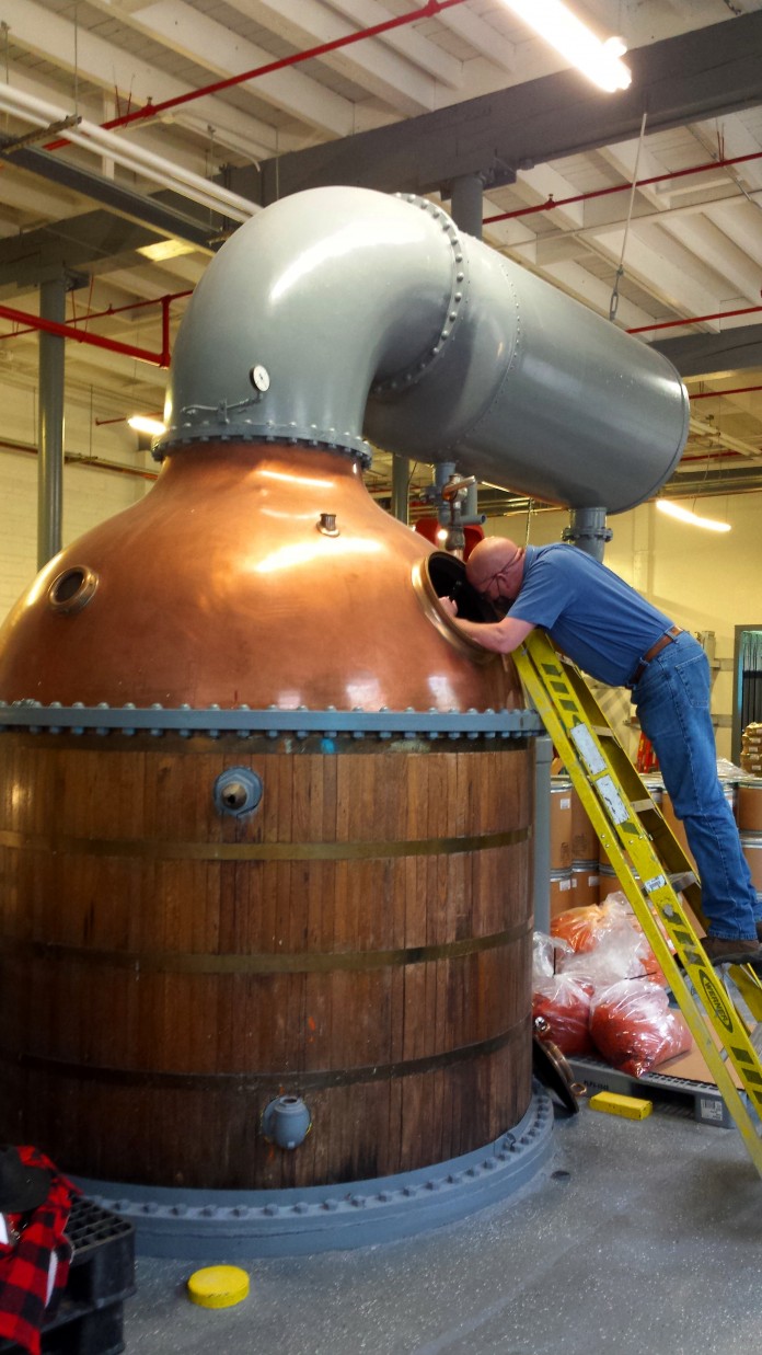Bourdon inspecting the still-condenser
