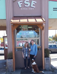 Longtime employee Iana Franks (left) and owner Carissa Dickson pose with Cyndi's loyal dog at the walk up window at Filling Station Espresso.