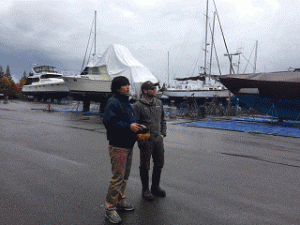 Naoya Nakadete, the Port’s first guest in the Sister  Marina exchange, tours the Boatworks with Marine  Services Supervisor Nathan Saline in October 2014.