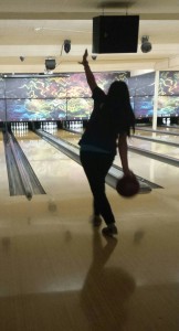 OHS bowling team member Justina Dizon aims for a strike during a non-team practice session at Aztec Lanes.