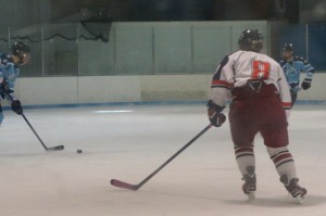 Leah fights for the puck on defense while playing with the Tacoma Rockets