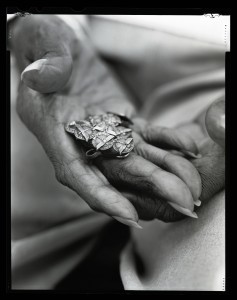 Josie Dunn, an original "Rosie the Riveter," worked for Boeing for over 40 years, and holds her service pins to prove it. Photo credit: Bettina Hansen