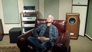 Rudy Barrera kicks back in the DescoAV listening room enjoying the enhanced experience.
