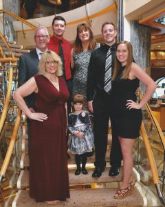 Tawnia’s immediate family: (back row from left) Guy, Alan, Ashley, Dillon. (front row from left): Tawnia, Brooklyn and Kara. Photo courtesy: Rob Rice Homes.