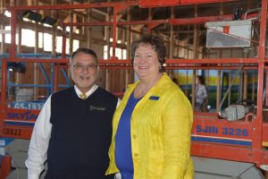 Ron Edwards, President/Principal and Therese Allin, Associate Principal celebrate the start of construction. Photo credit: Tammy Joy Losey