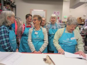 Volunteering at the Seattle Children's Bargain Boutique helps raise money for uncompensated care but also creates community among the volunteers. Photo courtesy: Olympia Bargain Boutique