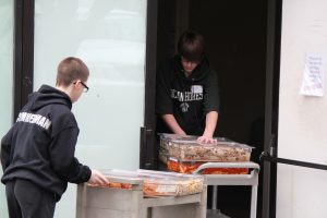 Students from Komachin Middle School bring left-over food from St. Martin's University to the Thurston County Food Bank. Photo courtesy: Thurston County Solid Waste