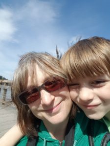 Janice Rosen is enrollment coordinator for OCS and is shown here with her son and OCS student, Sam. Parents are required to volunteer 65 hours per year. Photo credit:Janice Rosen