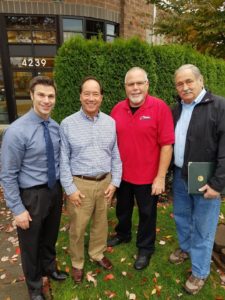 Attorneys Michael Montgomery and Harold Carr stand with Crime Stoppers chairperson John McCarthy and co-founder Ed Sorger. Photo credit: Jessica Hoppe.