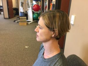 Dr. Jennifer Penrose demonstrates the starting position for the chin tuck. 