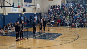 A group of STAND members perform an original spoken word poetry piece at the Martin Luther King Jr. Day assembly.