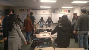 STAND members rehearse a "unity cheer" for the Martin Luther King Jr. Day assembly.