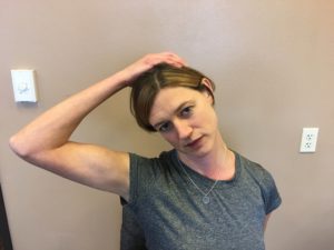Practice the upper trapezius stretch during the day pictured here.