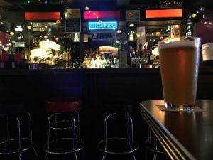 beer sitting on the counter in the dimly lit Brotherhood Lounge in Olympia