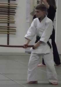 Aikido Olympia Alex trains with a bokken