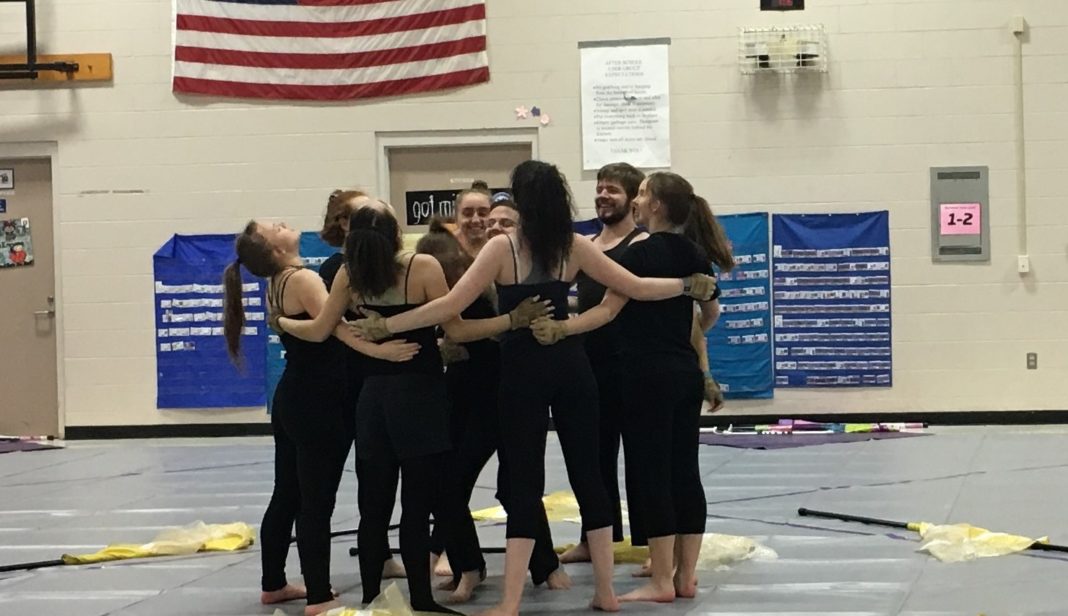 North Thurston High School Winterguard group huddle