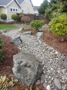 Gold Standard Landscaping and Lawn Services river rock