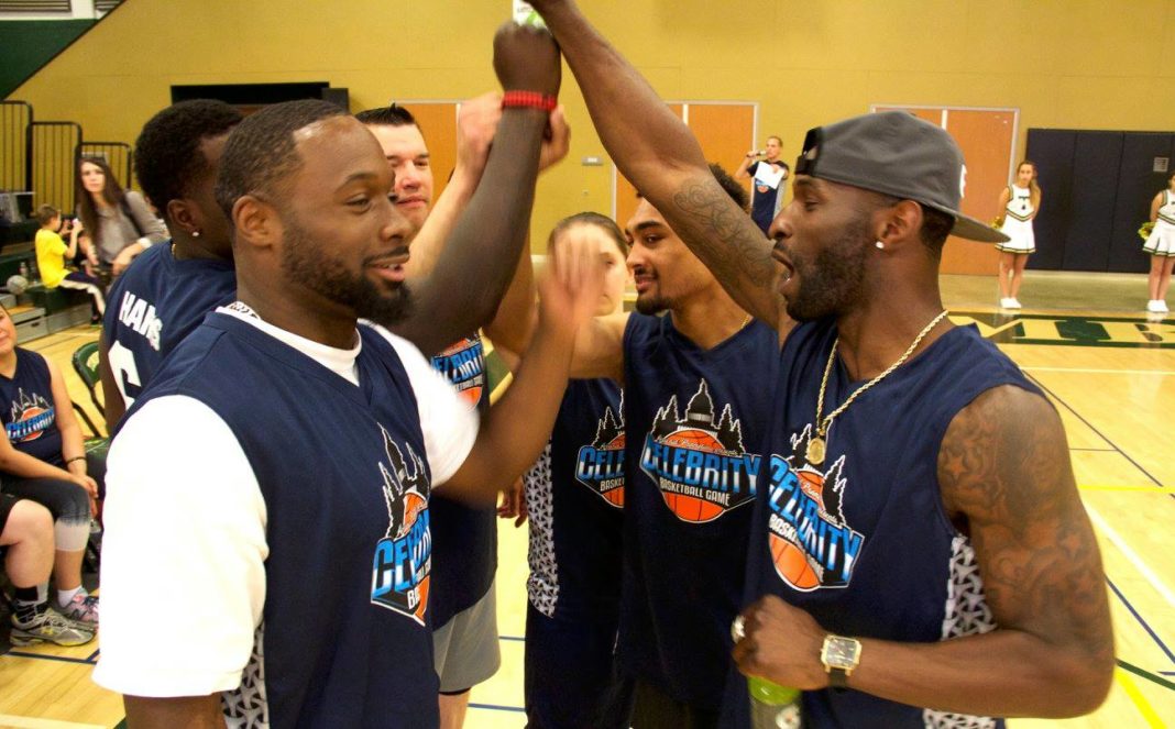 Celebrity Basketball Game Event team high-fives