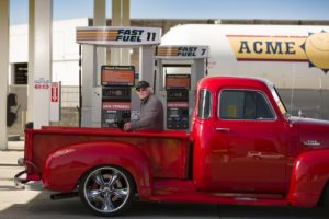 Acme Fast Fuel Vintage Red Truck at Pump