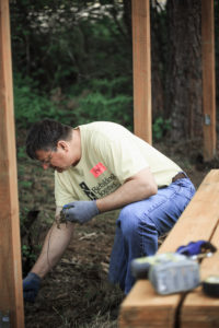 Rebuilding Together Thurston County Pete Kmet on knees